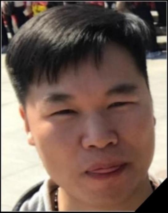 FBI photo of GUOCHUN HE