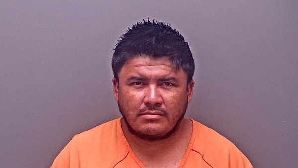 Mugshot of MARCOS FLORES-GUZMAN