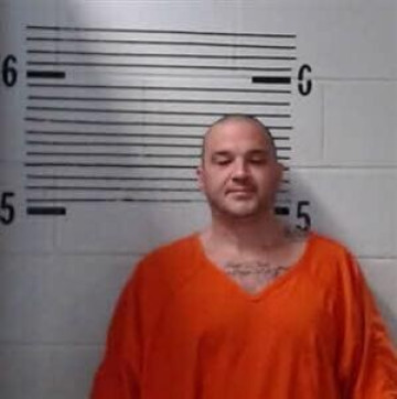 Mugshot of TATUM
