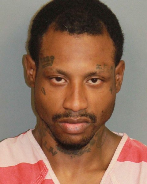 Mugshot of CARLOS LAMAR Junior FLANNIGAN
