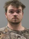 Mugshot of JUSTIN LEE MOORE