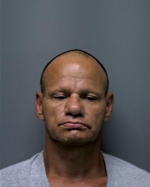Mugshot of L TAH