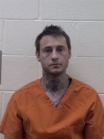 Mugshot of JUSTIN KYLE BAUMGARNER