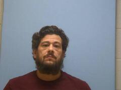 Mugshot of JUSTIN W MAHIKOA