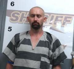 Mugshot of JUSTIN C REYNOLDS
