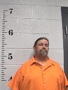 Mugshot of John Deckard