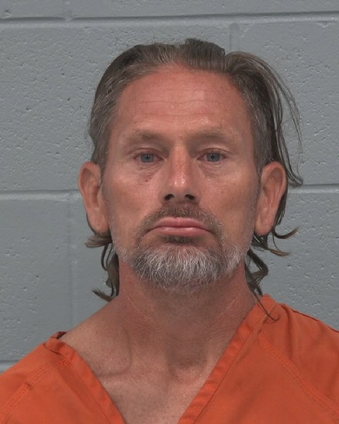 Mugshot of TRAVIS DEWITT HEID