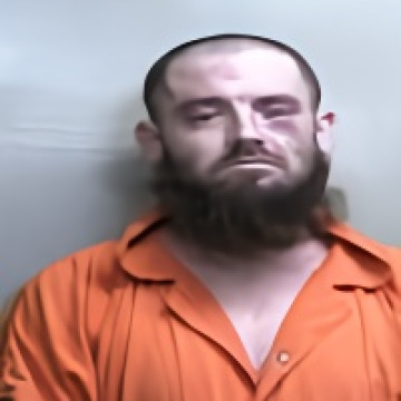 Mugshot of TRAVIS EUGENE GUMP-SCHROM