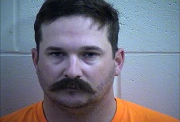 Mugshot of TRAVIS DALE DOWNEY