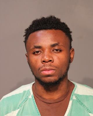Mugshot of AMISI ABINJA BYAOMBE