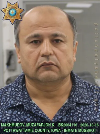Mugshot of MUZAFARJON KHOMIDJONOVICH MAKHMUDOV
