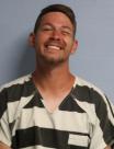 Mugshot of TRAVIS M RHODES