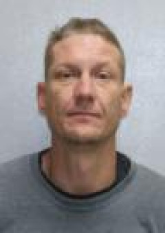 Mugshot of JUSTIN JEFFREY AURAND
