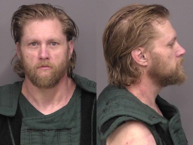 Mugshot of Justin Michael Dean Milholland
