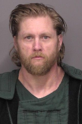 Mugshot of Justin Michael Dean Milholland