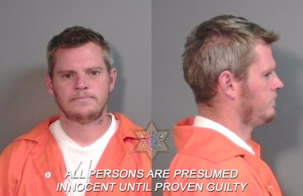 Mugshot of Travis Roy Rayner