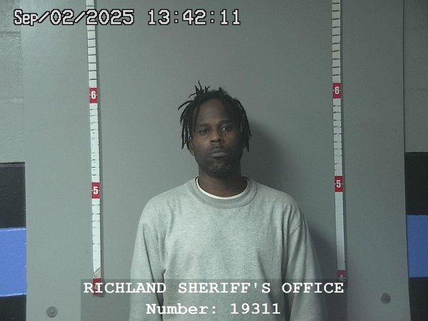 Mugshot of CLEVELAND J ELY