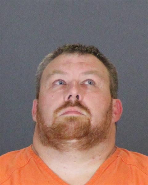 Mugshot of JOHN MICHAEL MCCOIG