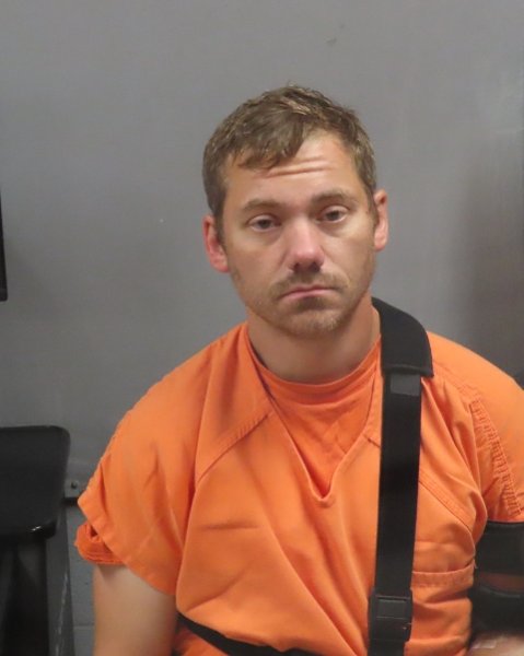 Mugshot of RYAN L HUGHES