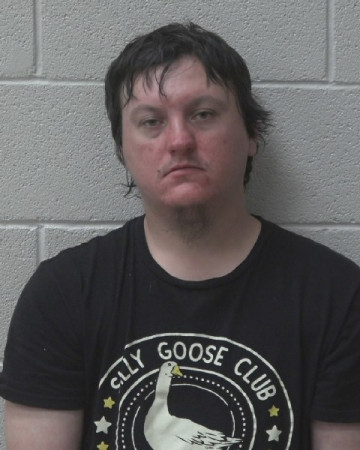 Mugshot of PATRICK TAYLORR KUNIK