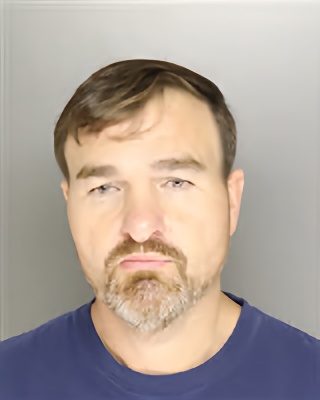 Mugshot of WILLIAM JUSTIN-BRYANT ROMERO