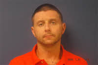Mugshot of Travis Robert Trusdell