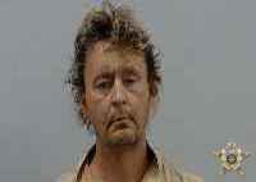 Mugshot of WILLIAM H WARNER
