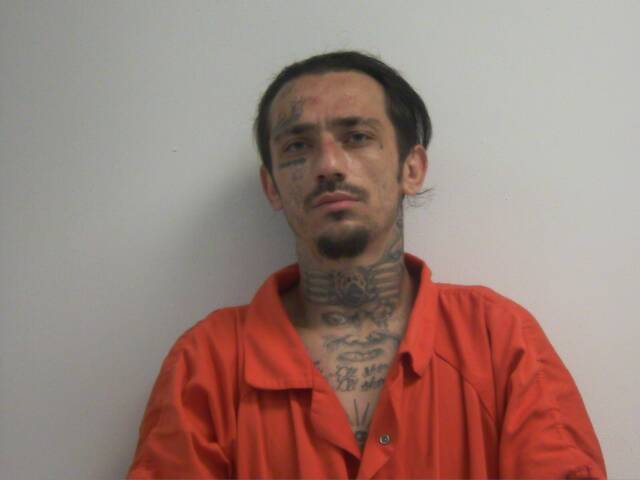 Mugshot of JUSTIN MICHAEL HUGHES