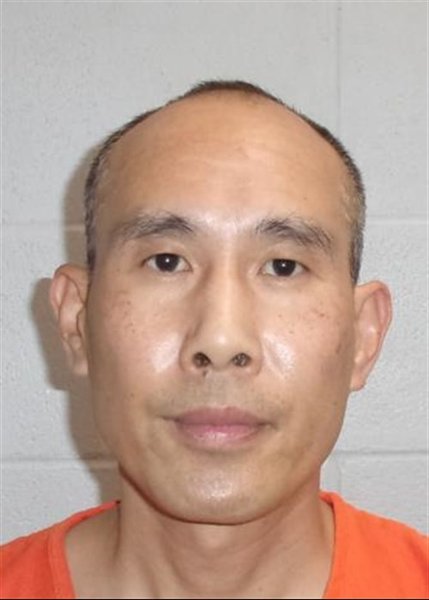 Mugshot of MINGDE HE