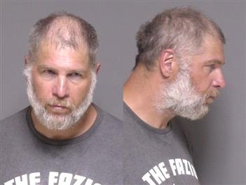Mugshot of Travis Hughes
