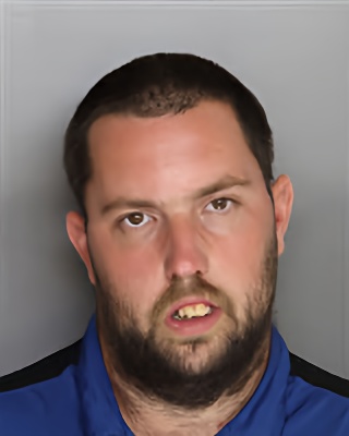 Mugshot of Justin Edwin Holmes