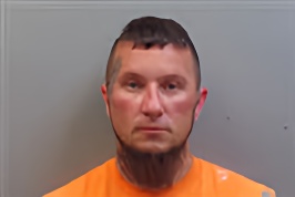 Mugshot of JOSHUA ADAM WOOLLEY