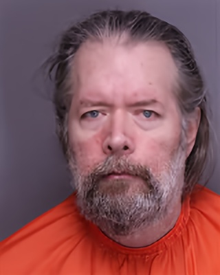 Mugshot of GEORGE MAXIE HARRISON