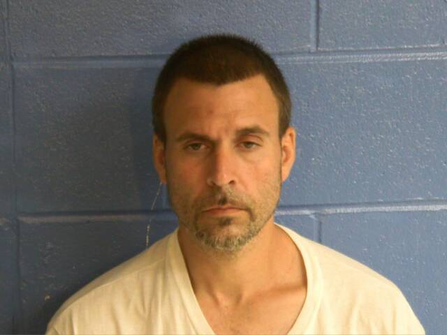 Mugshot of GEORGE A MENHART