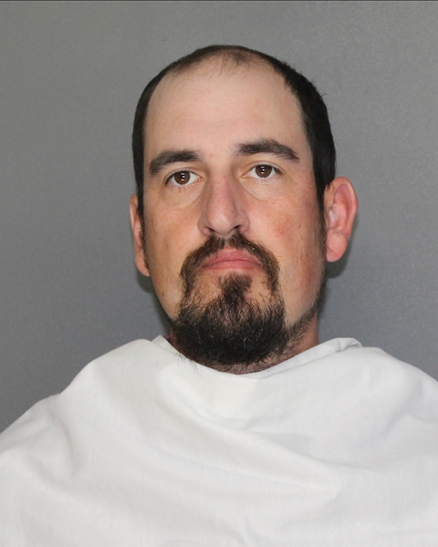 Mugshot of ZACHARY ALAN MENIKOS