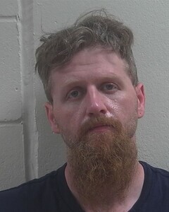 Mugshot of JUSTIN J HESTER