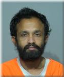 Mugshot of Hossain Suyud