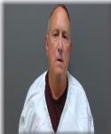 Mugshot of John Furdek